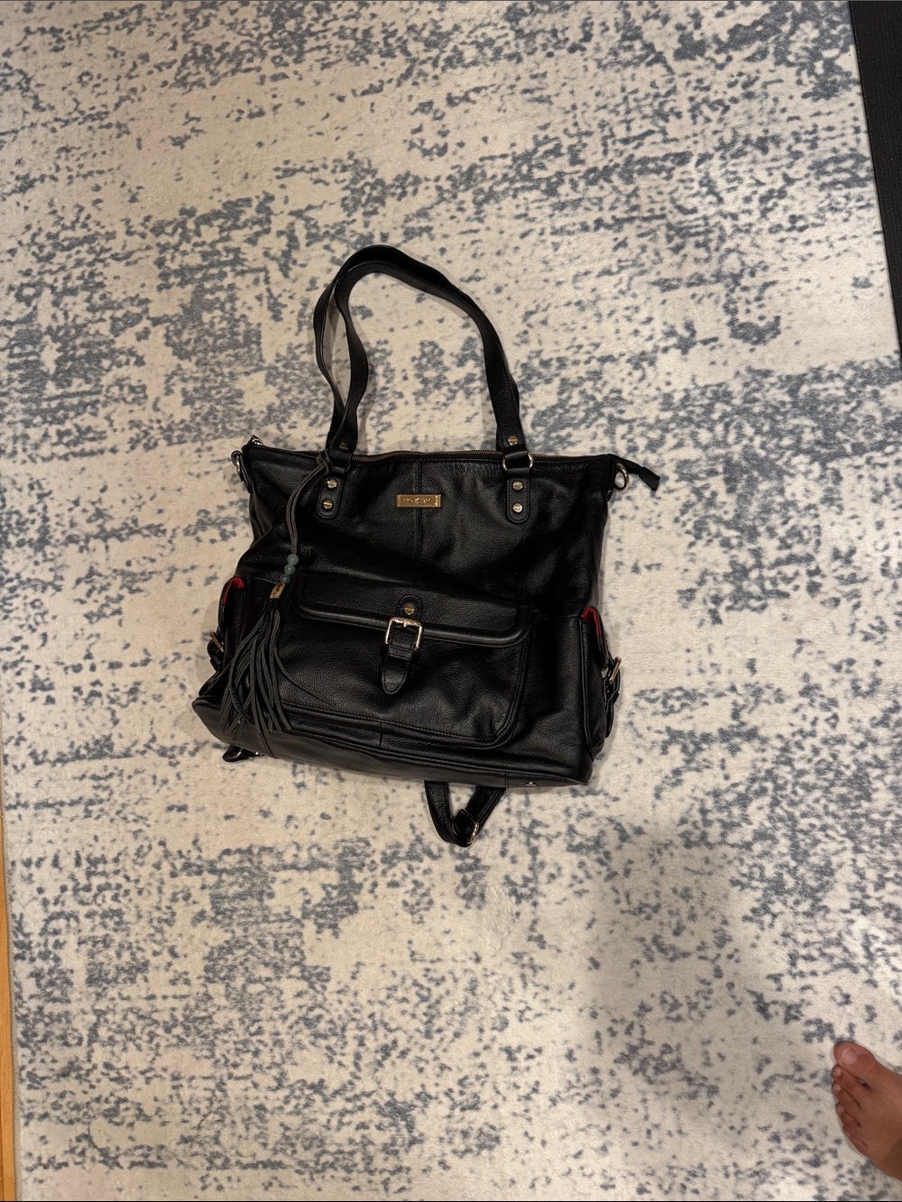 Black Leather Tote with Buckle Front Pocket and Tassel Accent